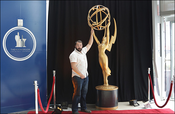 Justin Rondeau posing with the Emmy Statue at Content & Commerce Summit 2017